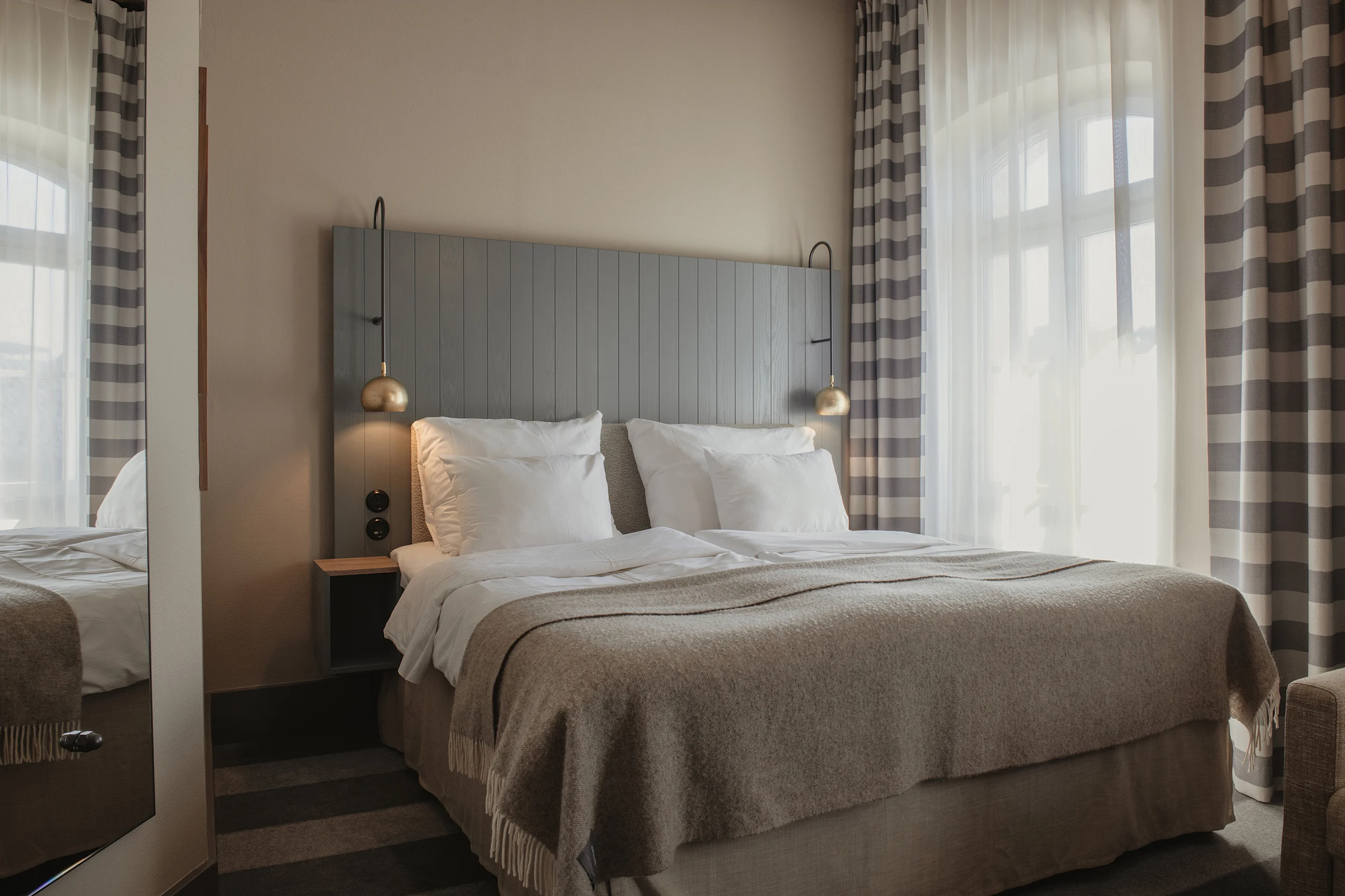 Hotellrum med dubbelsäng på Home Hotel Bilan